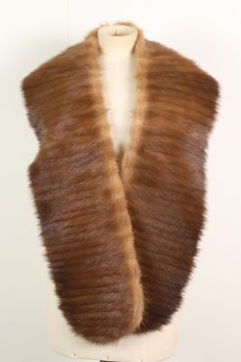 a close up of a fur vest on a mannequin mannequin