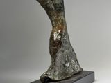 an image of a bronze sculpture of a bird on a base