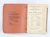 an old book opened to show a list of military equipment