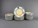 a set of twelve plates with floral designs on them