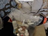 a pile of clothes and other items in a plastic bag