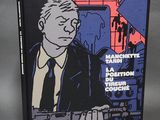 a book with a picture of a man in a suit and tie holding a gun