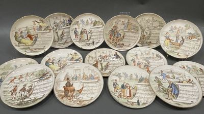 many plates with different designs on them on a table