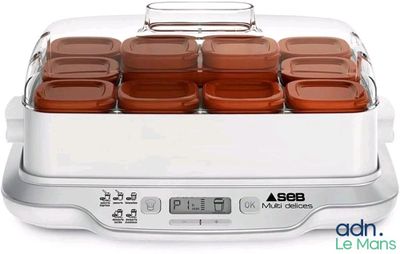 a close up of a food warmer on a white surface