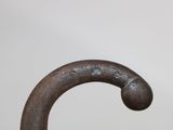a close up of a metal object on a white surface