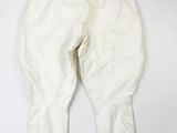 an image of a pair of white pants hanging on a wall