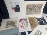 a lot of pictures on a table with a black background