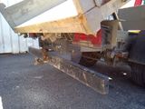 a dump truck that is sitting in the parking lot