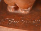 a bronze statue of a dog with a name engraved on it