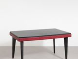 an image of a black and red coffee table with black legs
