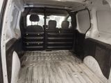 a white van that is parked in a lot