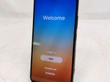 a close up of a phone with a welcome screen on it
