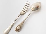silverware on a white table with a fork and a spoon