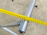 a measuring tape on the floor next to a table