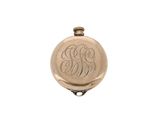 an image of a pocket watch with a monogram on the front