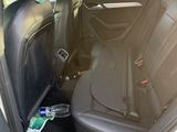the back seat of a car with a bunch of items in it