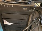 a computer with a hard drive and a mouse on top of it