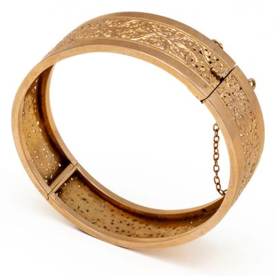 an image of a gold bracelet with a chain on a white background