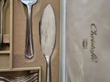 many forks and spoons that are in a box