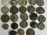 several different types of coins are arranged on a white surface
