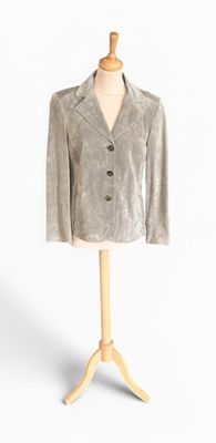 grey velvet jacket on a mannequin stand on a white background