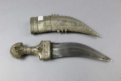 two knives that are sitting on a table
