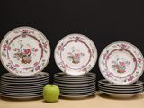 a lot of plates that are sitting on a table