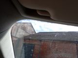 a view of a brick building through a car window