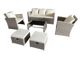a white wicker patio furniture set on a white background