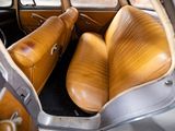 two leather seats in the back of a car
