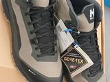 a pair of shoes on a box with a price tag
