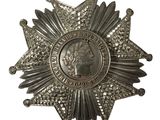 une image représentant une étoile argentée surmontée d'une couronne