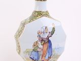 a vase with a picture of a man and a woman on it