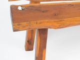 a wooden bench that is sitting on a white surface