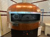 une photo d'un four à pizza dans une cuisine