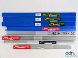 a lot of pens that are sitting on a table