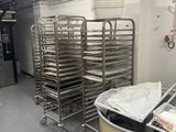 many trays of food in a large metal bowl