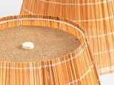pair of bamboo lamps with white dots on the lampshads