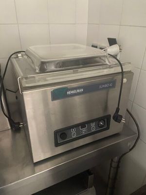 a machine that is sitting on a table in a kitchen
