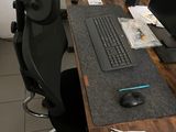 a desk with a computer and a monitor on it