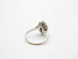 a close up of a silver ring on a white surface