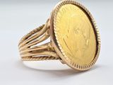 an image of a gold ring with a coin in the center