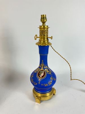 an image of a blue and gold lamp on a white background