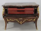 a marble top desk with two drawers on top of it