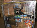 a metal cart with a lot of food inside of it