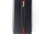 a black suitcase with a red zipper on the handle