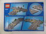 a box of lego city street set with instructions to make it look like it ' s in the middle of the street