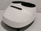 an image of a white and black machine on a table