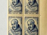 four stamps with a picture of a man on them on a piece of paper