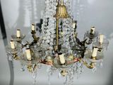 a chandelier made of glass and brass